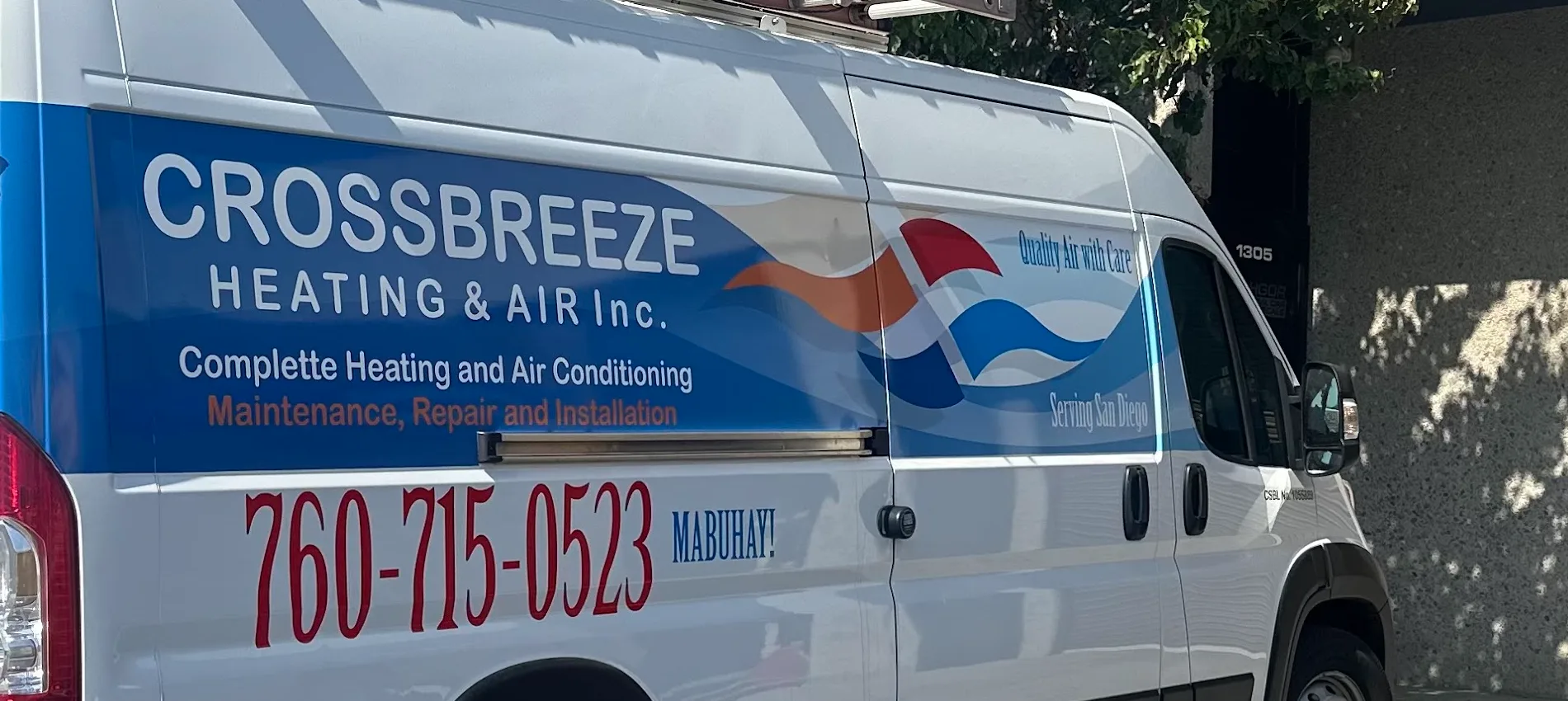The CrossBreeze Heating and Air van, with Mabuhay painted beside the phone number